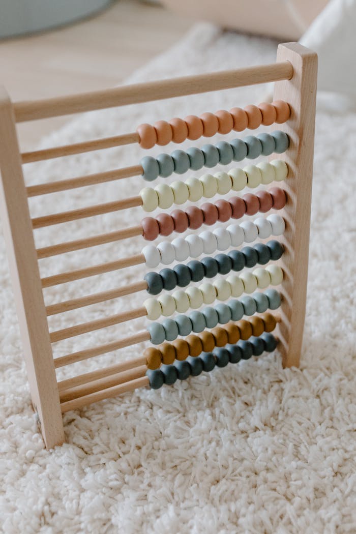 Colorful wooden abacus set against a soft carpet, ideal for learning and education themes.